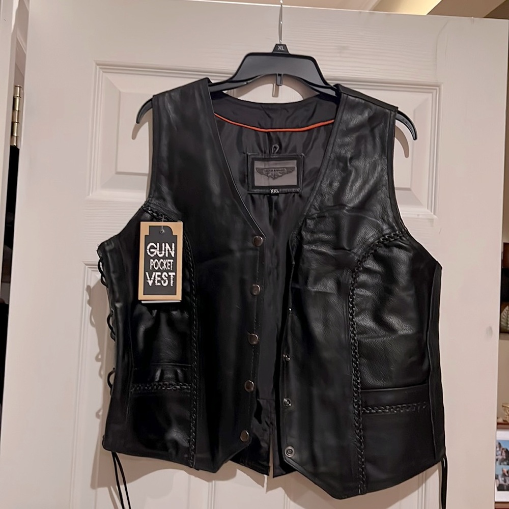 Black Leather biker vest with gun pocket. Braided leather detail. Never worn.